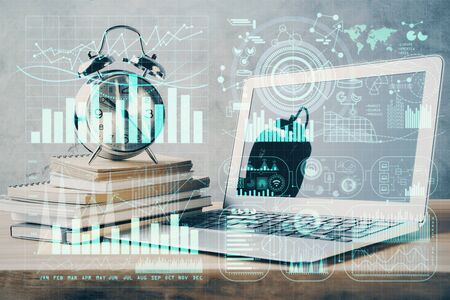 Double exposure of chart and financial info and work space with computer background. Concept of...