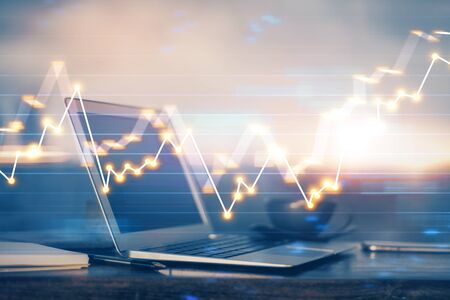 Stock market graph and table with computer background. Multi exposure. Concept of financial...