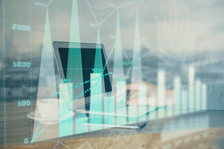 Multi exposure of chart with man typing on computer in office on background. Concept of hard work.の写真素材