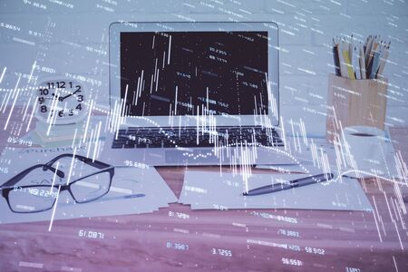 Stock market graph and table with computer background. Multi exposure. Concept of financial analysis.の写真素材