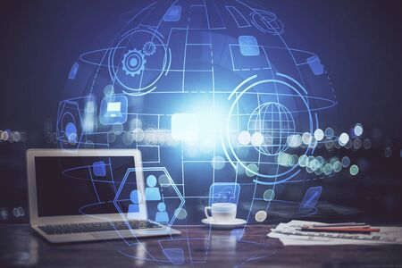 Computer on desktop with social network theme icon. Multi exposure. Concept of international connections.の写真素材