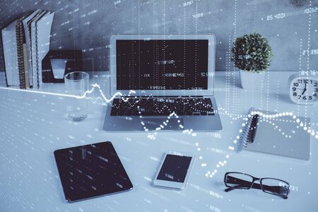 Stock market graph and table with computer background. Multi exposure. Concept of financial analysis.の写真素材