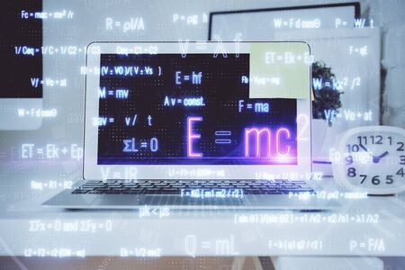 Desktop computer background and formula hologram writing. Double exposure. Education concept.