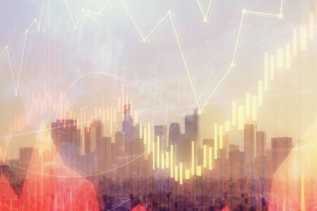 Forex chart on cityscape with skyscrapers wallpaper double exposure. Financial research concept.の写真素材