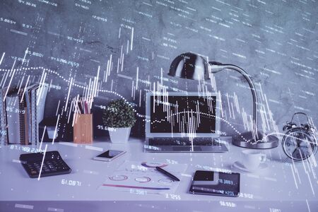 Multi exposure of graph and financial info and work space with computer background. Concept of international online trading.の写真素材