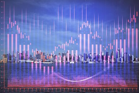 Forex graph on city view with skyscrapers background double exposure. Financial analysis concept.の写真素材
