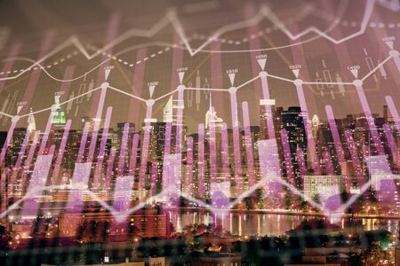 Double exposure of forex chart drawings over cityscape background. Concept of success.の写真素材