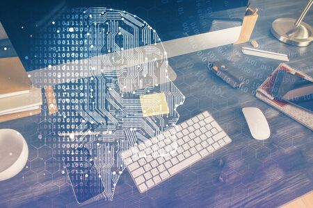 Double exposure of table with computer and brain hologram. Data innovation concept.