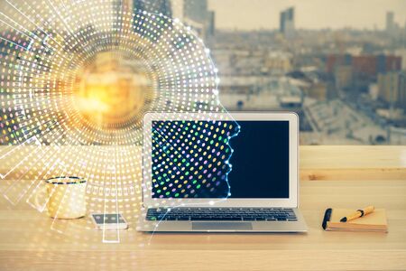 Double exposure of table with computer and brain hologram. Data innovation concept.の写真素材