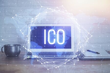 Double exposure of blockchain theme hologram and table with computer background. Concept of bitcoin crypto currency.の写真素材