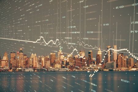 Financial graph on night city scape with tall buildings background double exposure. Analysis concept.の写真素材