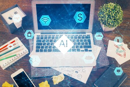 Double exposure of laptop computer and technology theme hologram. Concept of freelance work.の写真素材
