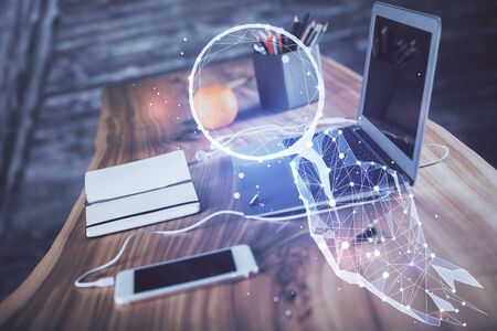Desktop computer background in office and start up theme hologram drawing. Double exposure. Startup...