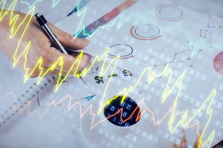 Multi exposure of man planing investment with stock market forex chart background. Concept of...