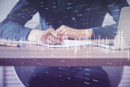 Double exposure hands with stock market chart. Concept of research and analysis.