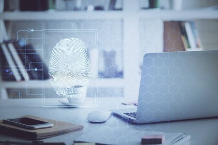 Computer on desktop in office with finger print drawing. Double exposure. Concept of business data...