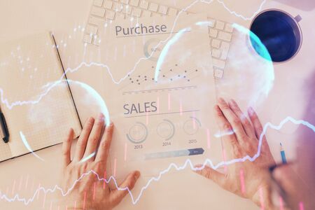 FOREX chart multi exposure with work table background. Top View. Concept of success.の写真素材