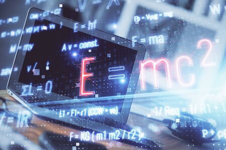 Desktop computer background and formula hologram writing. Double exposure. Education concept.