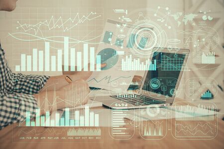 Double exposure of financial graph with man works in office on background. Concept of analysis.の写真素材