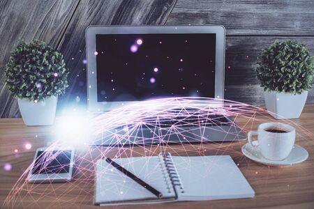 Computer on desktop with social network theme icon. Multi exposure. Concept of international connections.の写真素材