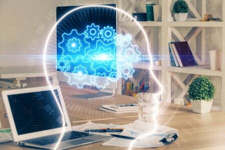 Double exposure of work table with computer and brain sketch hologram. Brainstorming concept.