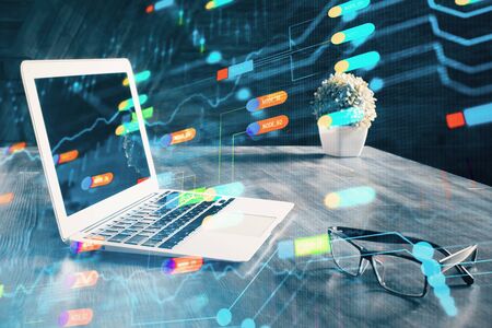 Double exposure of laptop computer and technology theme hologram. Concept of freelance work.