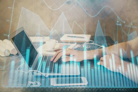 Double exposure of forex chart with man working on computer on background. Concept of market analysis.の写真素材