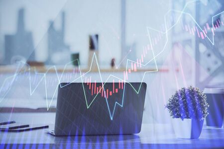 Stock market graph and table with computer background. Double exposure. Concept of financial analysis.の写真素材