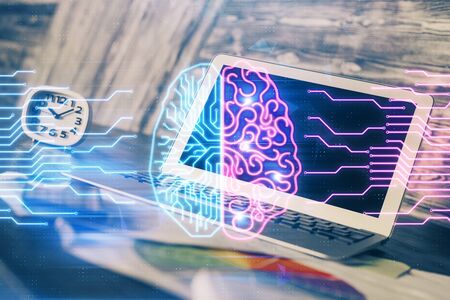 Multi exposure of work space with computer and human brain hologram. Brainstorm concept.