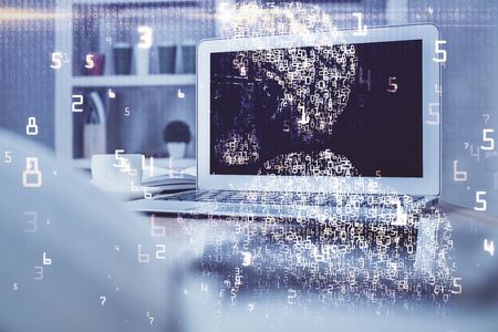 Computer on desktop in office with technology theme hologram. Multi exposure. Tech concept.の写真素材