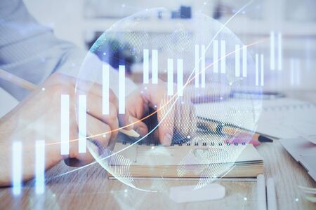 Multi exposure closeup hands with stock market forex graph. Concept of research and analysis.の写真素材