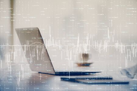 Double exposure of forex graph and work space with computer. Concept of international online...