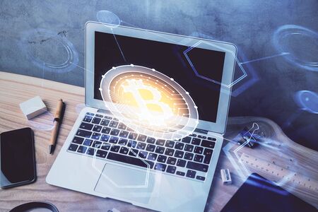 Double exposure of blockchain theme hologram and table with computer background. Concept of bitcoin...