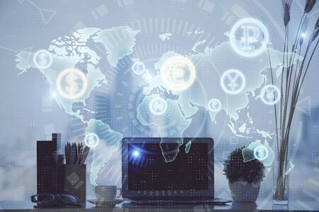 Stock market graph and table with computer background. Double exposure. Concept of financial...