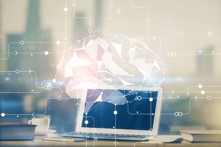 Double exposure of work table with computer and brain sketch hologram. Brainstorming concept.