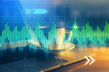 Financial chart drawing and table with computer on background. Multi exposure. Concept of...