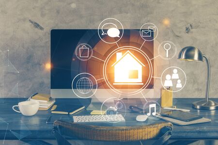 Desktop computer background in office and big town buildings hologram drawing. Double exposure. Smart city concept.の写真素材