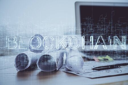 Double exposure of blockchain and crypto economy theme hologram and table with computer background. Concept of bitcoin cryptocurrency.の写真素材