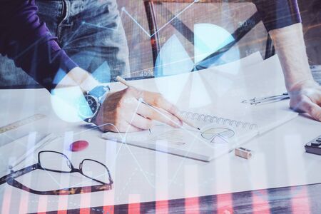 Financial trading chart doble exposure with man desktop background. Concept of success.の写真素材
