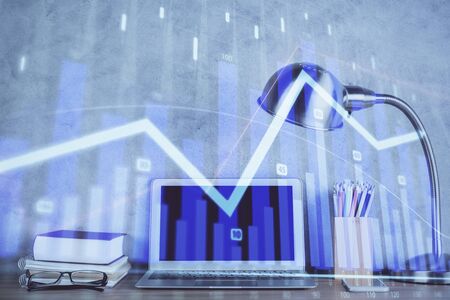 Multi exposure of graph and financial info and work space with computer background. Concept of international online trading.の写真素材