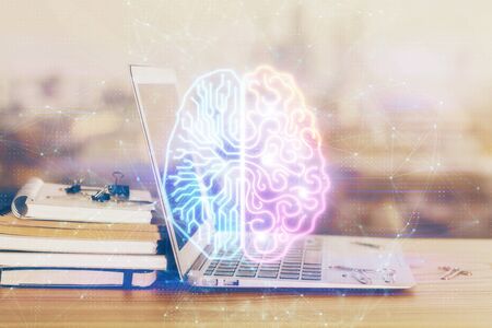 Multi exposure of work table with computer and brain hologram. Brainstorm concept.