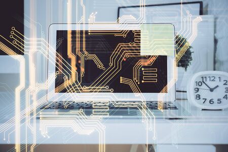 Computer on desktop in office with technology theme hologram. Multi exposure. Tech concept.の写真素材