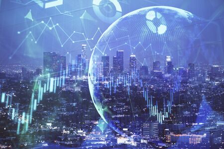 Financial graph on night city scape with tall buildings background double exposure. Analysis...