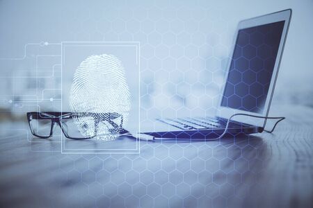 Computer on desktop in office with finger print drawing. Double exposure. Concept of business data...