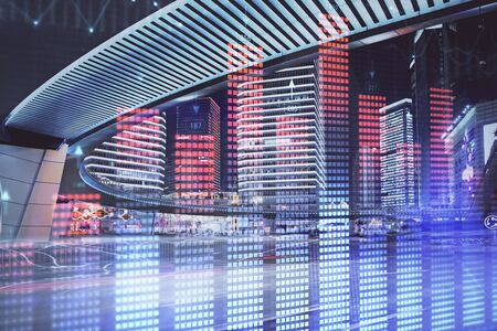 Forex chart on cityscape with tall buildings background multi exposure. Financial research concept.の写真素材