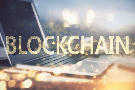 Double exposure of blockchain theme hologram and table with computer background. Concept of bitcoin...