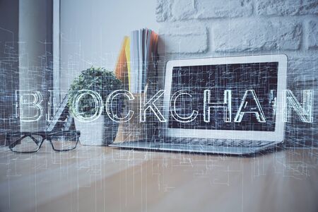 Double exposure of blockchain theme hologram and table with computer background. Concept of bitcoin...