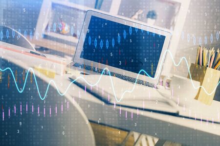 Financial graph colorful drawing and table with computer on background. Double exposure. Concept of...