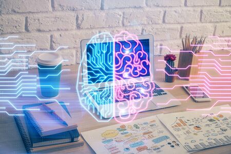 Multi exposure of work space with computer and human brain hologram. Brainstorm concept.