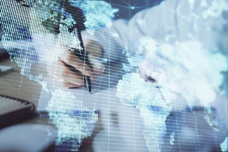 International business hud over womans hands writing background. Concept of hard work. Double exposureの写真素材